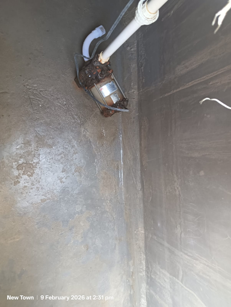Technician performing high-pressure tank cleaning